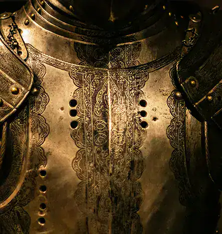 Historical medieval armor with detailed engravings and craftsmanship.